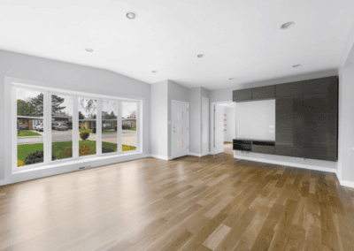 Bright open living room with freshly painted white walls and ceiling