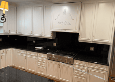 Painted off-white kitchen cabinets with black granite counters in Chicago