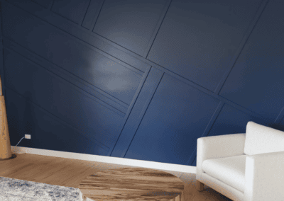 Navy blue living room accent wall with geometric trim molding in Deerfield